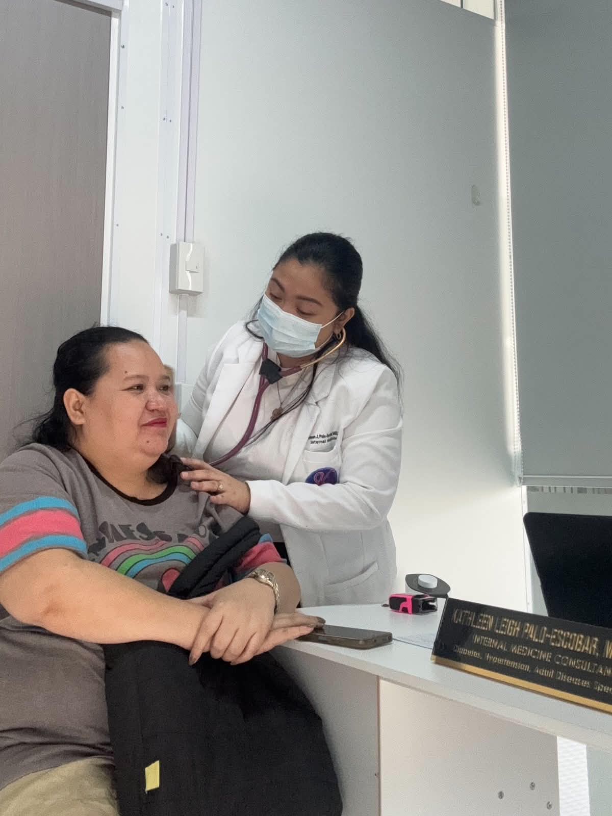 Doctor examining patient at Health Plus